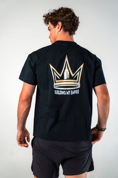 Back view of male athlete wearing the black Builders Tee relaxed fit gym t-shirt Building My Empire graphic by Empire Fit