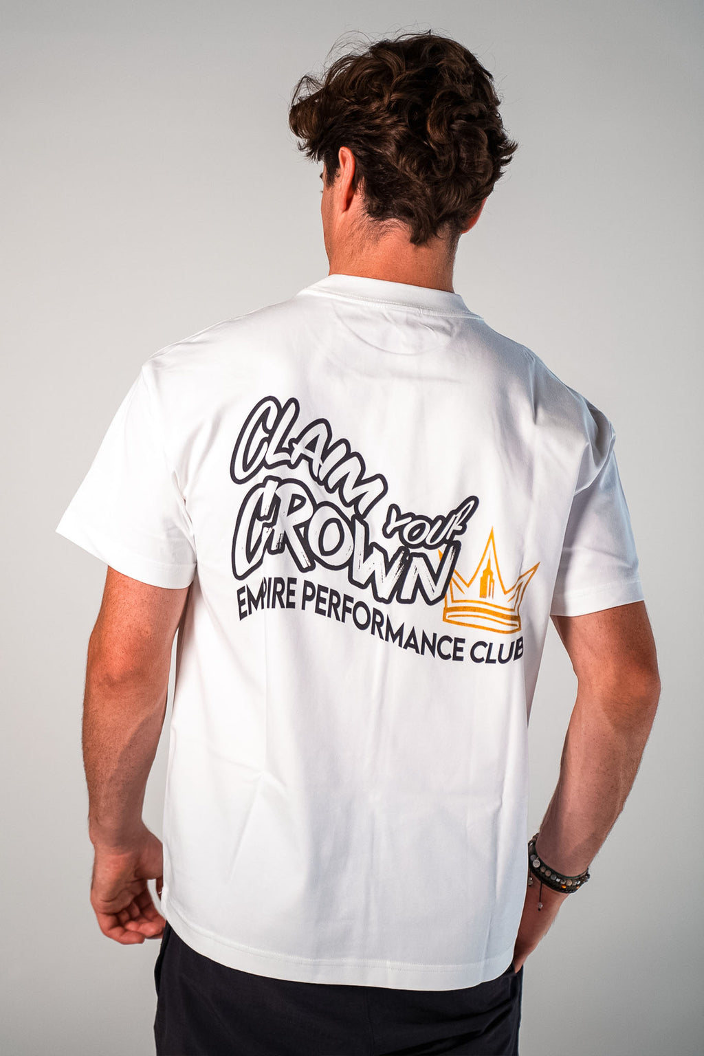 Back graphic of the white and black Claim Your Crown Tee relaxed fit gym t-shirt by Empire Fit