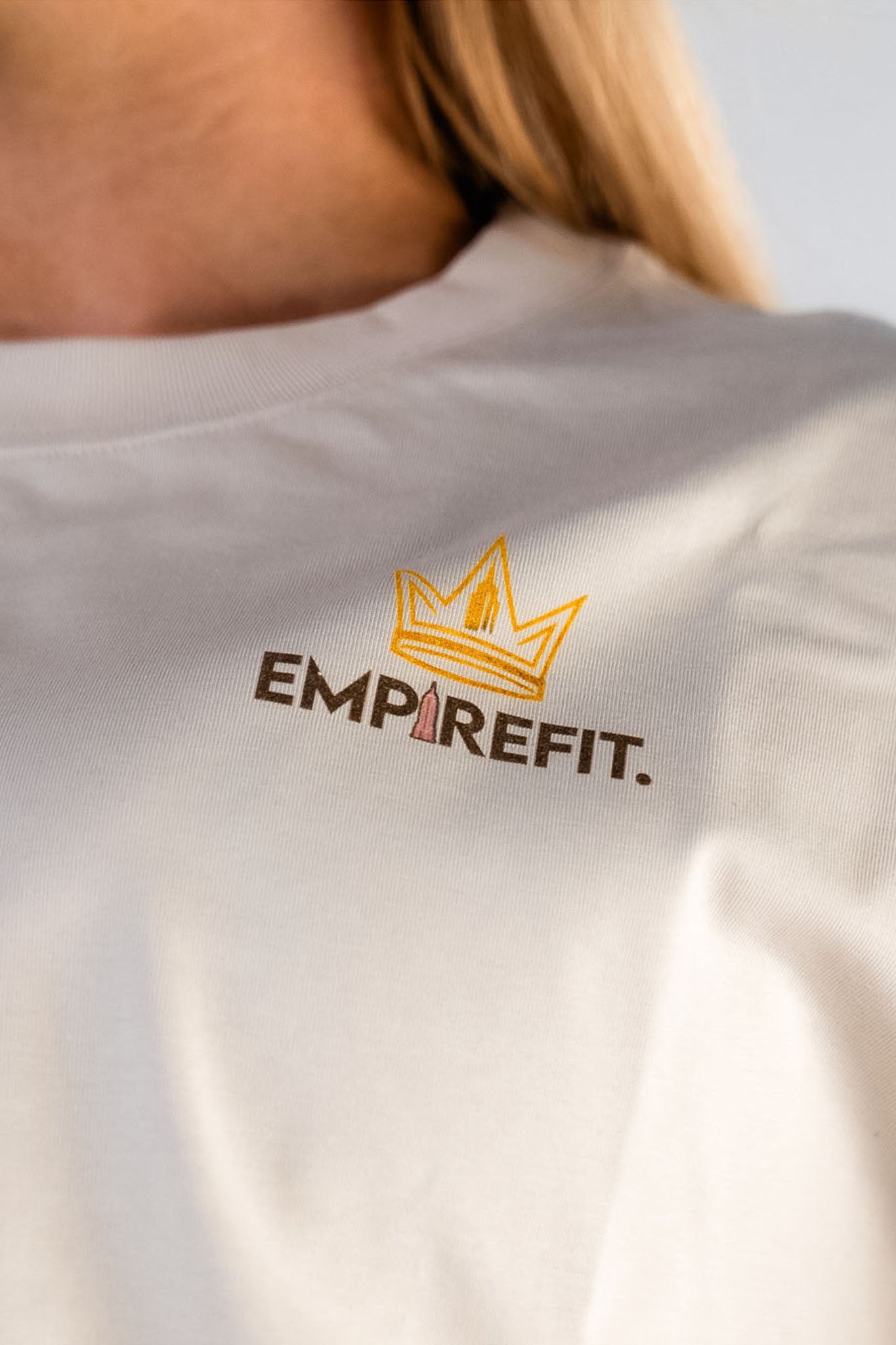 Close-up Empire Fit crown logo beige Essentials Crown Tee relaxed fit gym t-shirt by Empire Fit