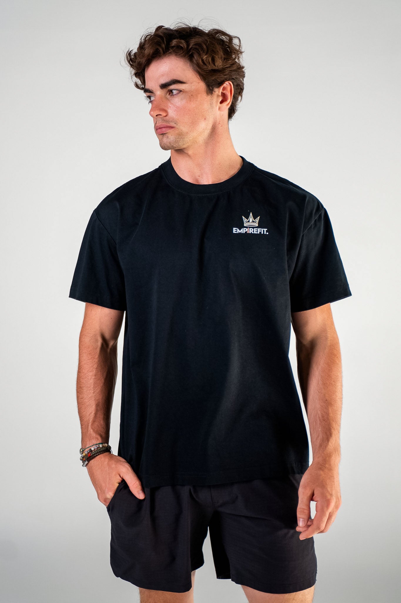 Front view of the black Essentials Crown Tee relaxed fit gym t-shirt by Empire Fit