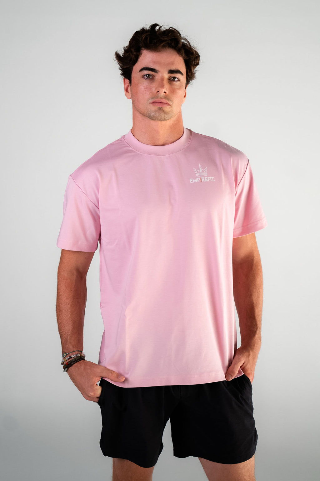 Male athlete wearing the blush Empire in Motion Tee by Empire Fit